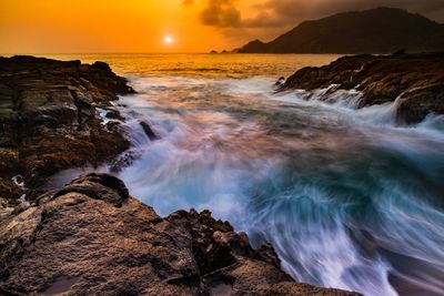 Scenic view of sea against sky during sunset