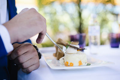 Close-up of hand holding ice cream