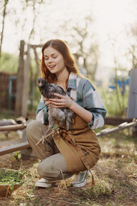 Woman holding hen