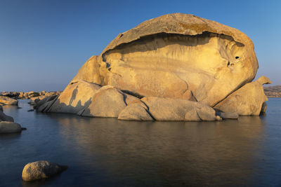 Sunset on the octopus head beach in la maddalena, sassari province, sardinia, italy, europe.