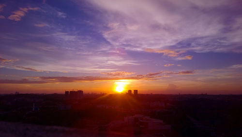 High angle view of buildings against sky during sunset