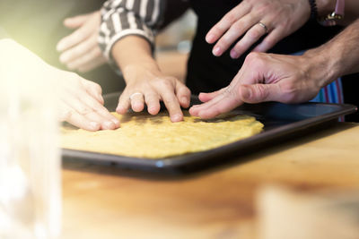 Midsection of woman preparing food