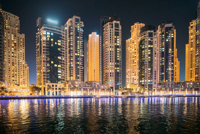 Illuminated buildings in city at night