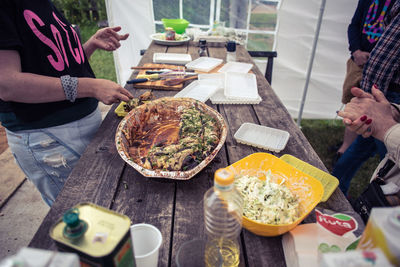 Close-up of people holding food