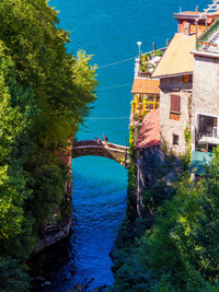 High angle view of canal amidst buildings