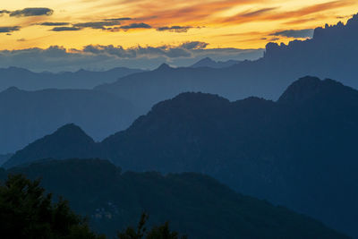 Scenic view of mountains against sky during sunset