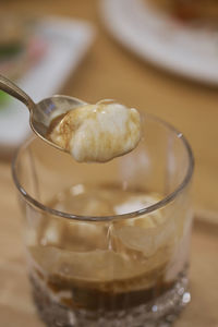 Close-up of ice cream in glass on table