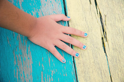 Cropped hand on pier