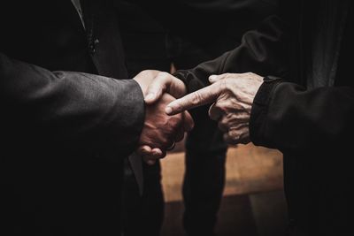 Close-up of man holding hands