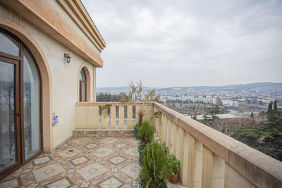 View of buildings against cloudy sky