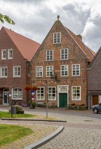 Street by building against sky