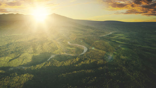 Scenic view of landscape against sky during sunset