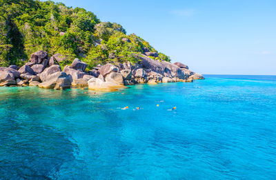 Scenic view of sea against rocks