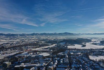 Aerial view of cityscape against sky