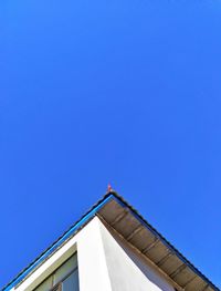 Low angle view of building against clear blue sky