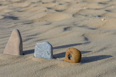 High angle view of stones set in sand at beach