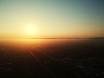 Scenic view of sunset over city