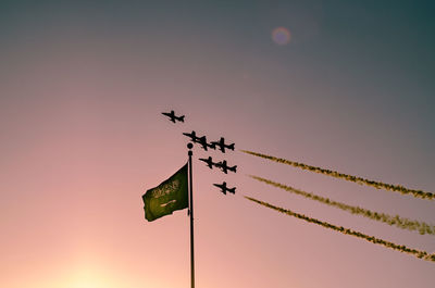 Low angle view of birds flying in sky