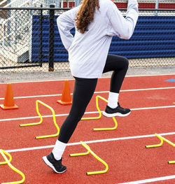 Rear view of woman running