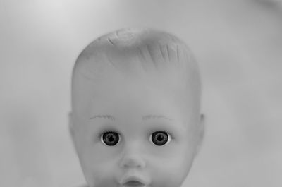 Close-up of doll against white background