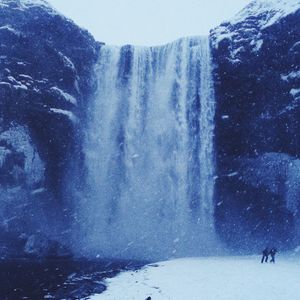 Scenic view of sea with mountain in background