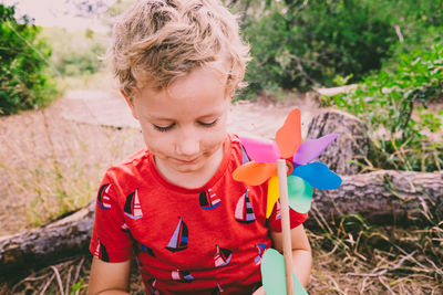 Cute boy holding toy