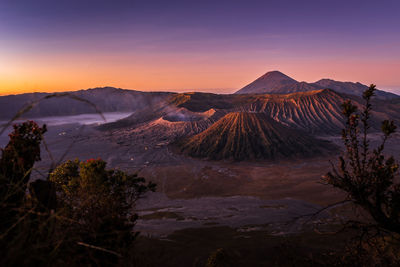 Scenic view of mountain range against sky during sunset