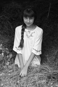Portrait of teenage girl on grass