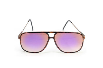 Close-up of sunglasses against white background