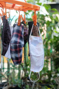 Close-up of clothes hanging on clothesline