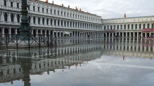 Reflection of building in puddle