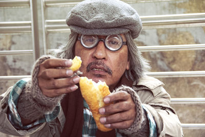 Portrait of man eating food