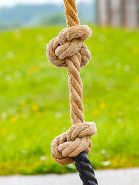 White twisted rope and double knots at outdoor playground.