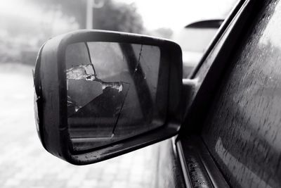 Reflection of car on side-view mirror