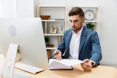 Businessman working at desk in office