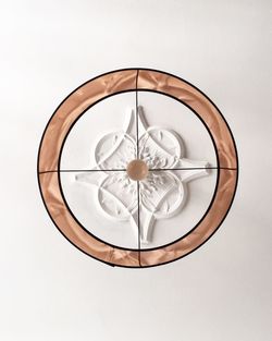 Directly above shot of lamp against white background