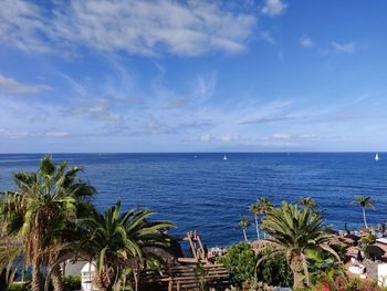 Scenic view of sea against blue sky