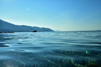 Scenic view of sea against clear blue sky