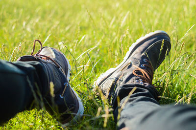 Low section of man resting on field