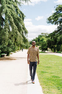 Positive afro american stylish man in european city