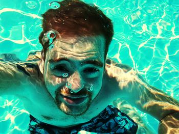 Portrait of young man in swimming pool