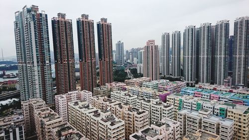 High angle view of modern buildings in city against sky