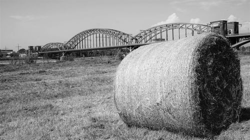 Bridge on field against sky