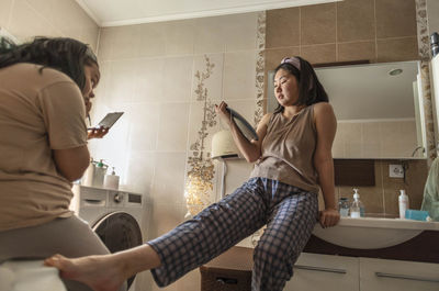 Asian young beauties teens start their morning routine with makeup in the bathroom