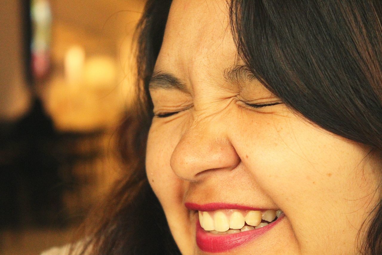 headshot, person, close-up, young adult, human face, lifestyles, young women, indoors, leisure activity, portrait, front view, eyes closed, looking at camera, contemplation, focus on foreground, studio shot