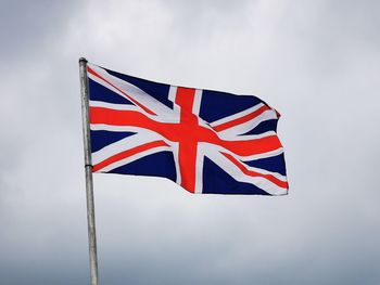 Low angle view of flag against sky