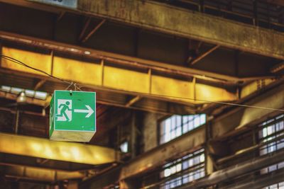 Arrow sign against the ceiling