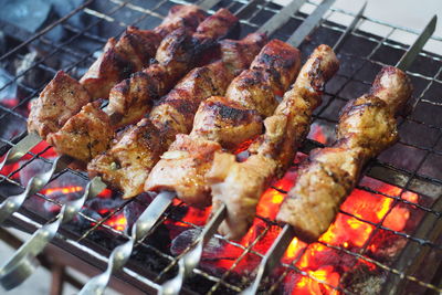 Close-up of meat on barbecue grill