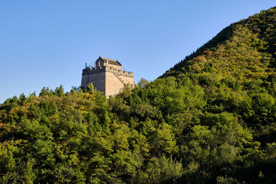 Low angle view of historic building against blue sky