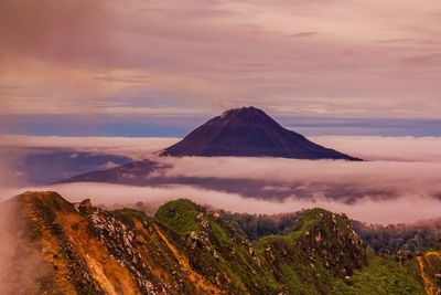 Scenic view of mountains against sky at sunset